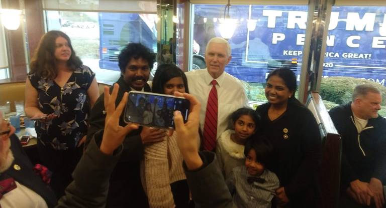 Mike Pence poses for photographs with supporters at the Lyndon Diner, Lancaster, Pa