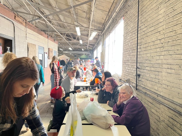 RIDGWAY,Pa.  â Mountain Fest festival attendees enjoy the drinks and meals from food trucks. 
