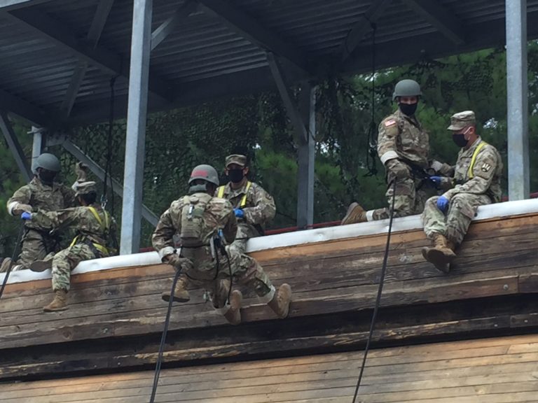 U.S. Army recruits from Echo Company, 2nd Battalion, 39th Infantry Regiment wear face masks to prevent the spread of the coronavirus while practicing rappelling at Victory Tower on the Army's largest basic combat training center at Fort Jackson, South Carolina.