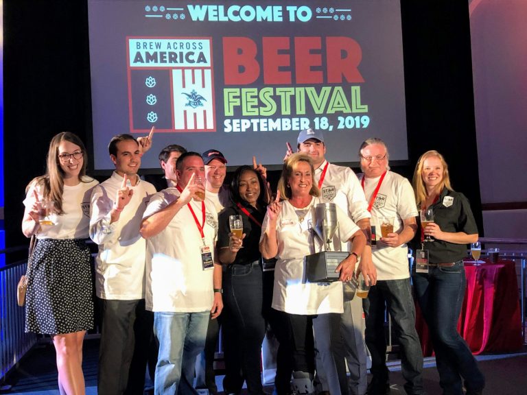 Missouri Rep. Ann Wagner is shown holding her Brew Democracy Cup beside her staff and members of the Anheuser-Busch St. Louis Brewery.