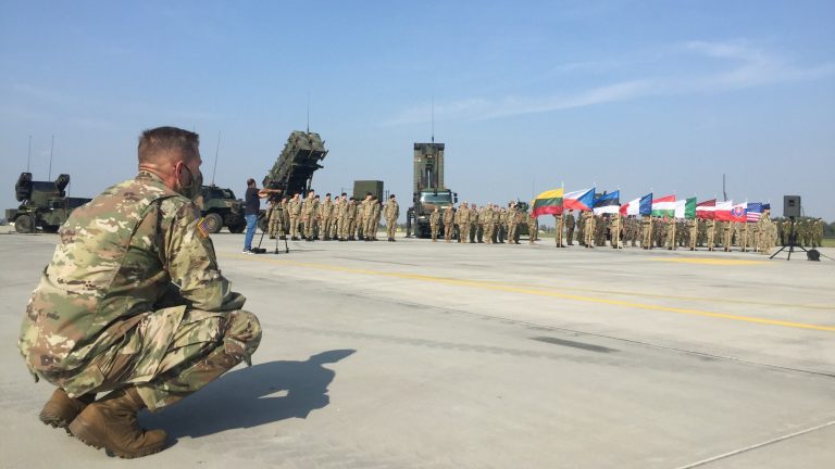 An American soldier observes the closing ceremony of the Tobruq Legacy multinational NATO aerial defense exercise at Siauliai Air Base in Lithuania September 25, 2020, where Amerian rotational troops help defend the NATO ally against Russian aggression.