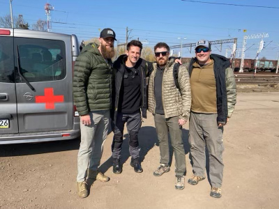 Josh Brock, Vlad Finn, Tyler Merritt, and James Zumwalt at the Poland-Ukraine border just before entering for their 72-hour mission to rescue and relocate 400 orphans. 