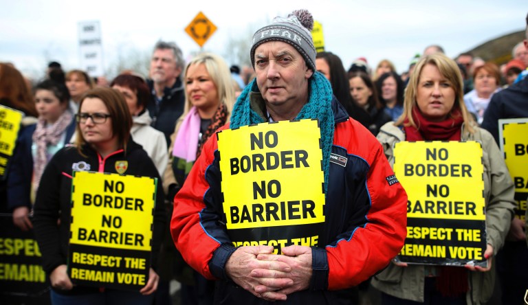 In this Saturday, March 30, 2019 file photo, protesters stage an anti Brexit rally on the Old Dublin Road, in Carrickcarnon, Ireland. With Brexit due on Oct. 31, 2019 and a costly no-deal a possible outcome, experts still do not know, or are reluctant to say, exactly what checks are likely at the Irish border. 