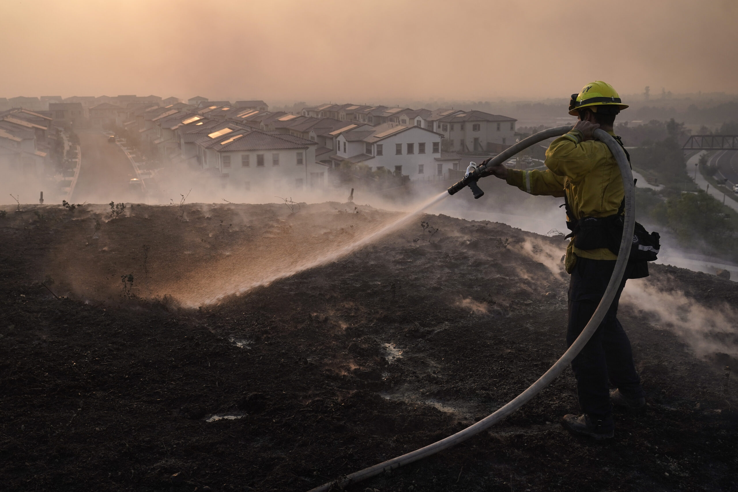 Wildfire in Orange County forces thousands to evacuate, leaves two firefighters critically injured