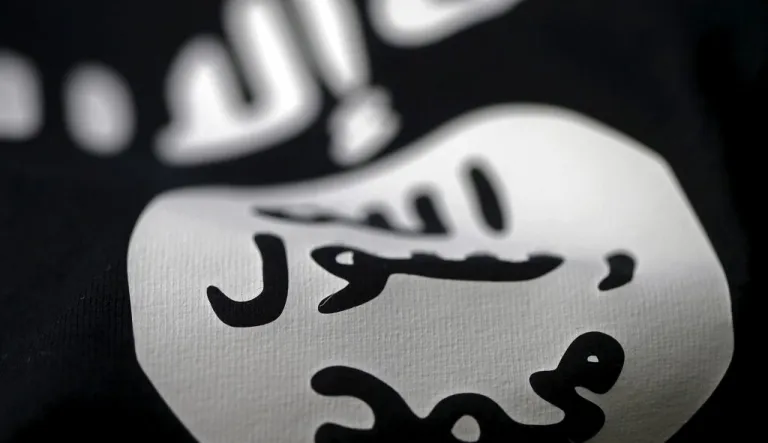 A close-up image of the Islamic State group flag.