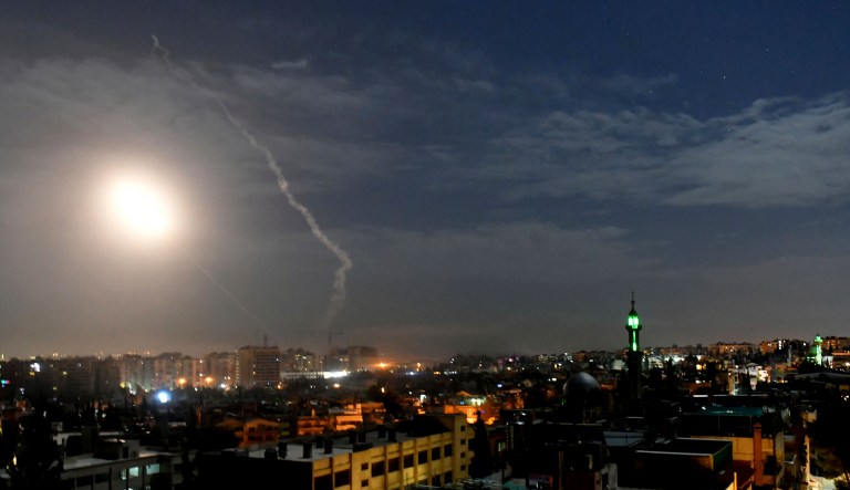 This photo released by the Syrian official news agency SANA, shows missiles flying into the sky near international airport, in Damascus, Syria, Monday, Jan. 21, 2019. In a very unusual move, the Israeli military has issued a statement saying it is attacking Iranian military targets in Syria. It is also warning Syrian authorities not to retaliate against Israel. 