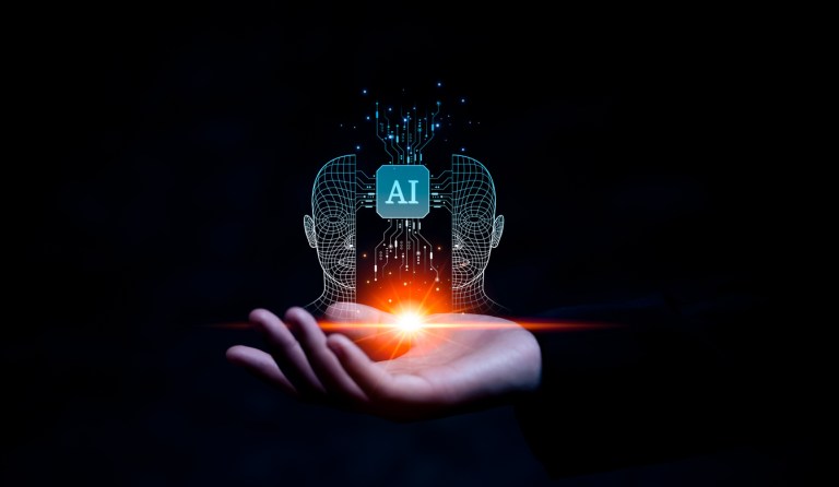 Business hand holding AI icon.