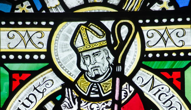 A Victorian stained glass window depicts Saint Nicholas.