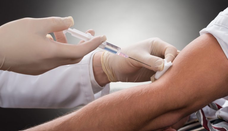 Close-up of a doctor giving a patient a vaccination. 