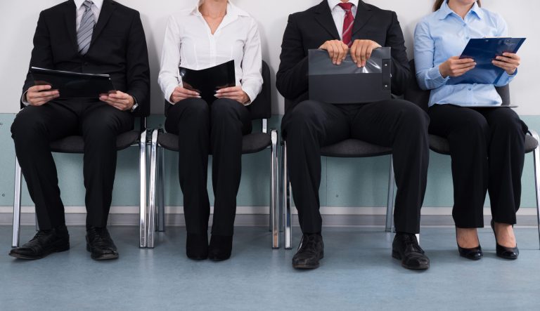 Close-up of buisnesspeople sitting.