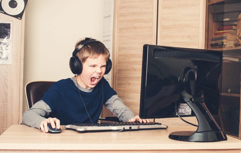 Angry child screaming at video game