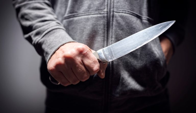 A man holding a knife.