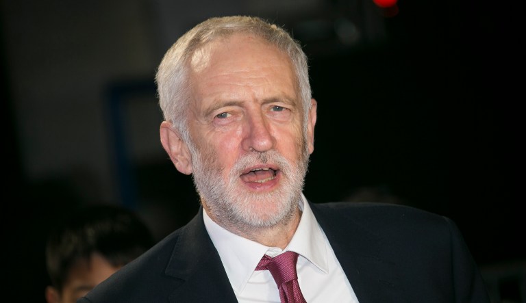 Politician Jeremy Corbyn poses for photographers upon arrival for the Pride of Britain Awards at a central London hotel, Monday, Oct. 29, 2018.