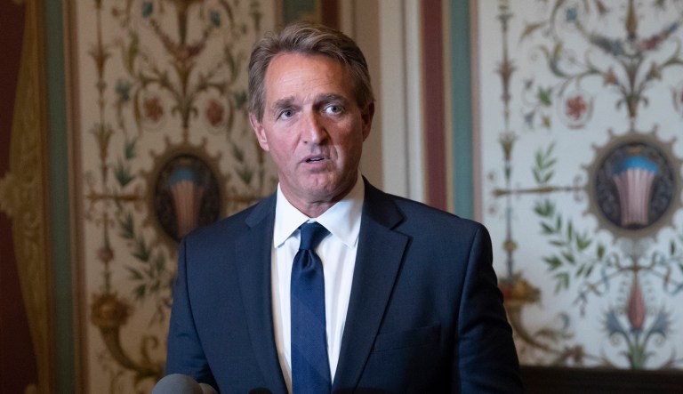 Sen. Jeff Flake, R-Ariz., a member of the Senate Foreign Relations Committee speaks with reporters about meeting with Canada's Minister of Foreign Affairs Chrystia Freeland on Capitol Hill in Washington, Wednesday, June 13, 2018. The meeting with Freeland comes after President Donald Trump insulted Canadian Prime Minister Justin Trudeau at the Group of Seven summit, calling him "dishonest" and "weak," after the prime minister spoke against American tariffs on steel and aluminum.
