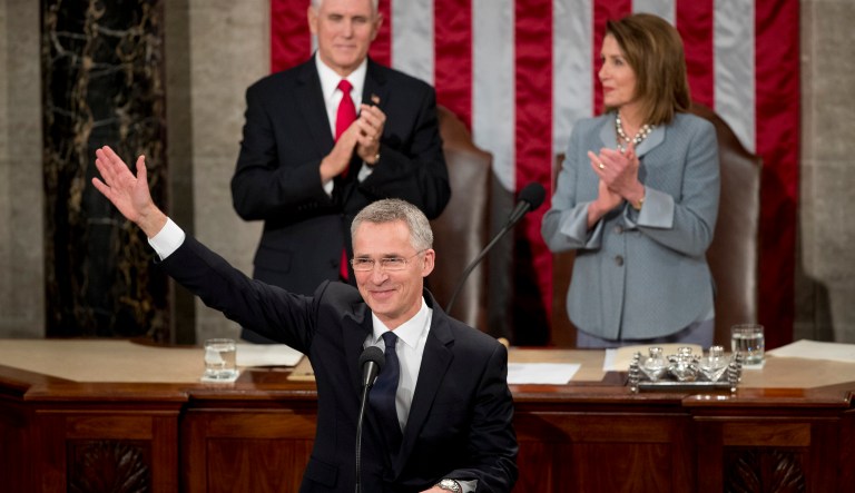 NATO Secretary General Jens Stoltenberg, accompanied by Vice President Mike Pence, left and House Speaker Nancy Pelosi of Calif., right, waves as he takes the stage to address a Joint Meeting of Congress on Capitol Hill in Washington, Wednesday, April 3, 2019.