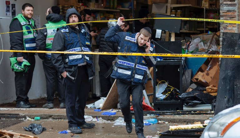 Responders work to clean up the scene of a shooting that left multiple dead at a kosher market on Dec. 11, 2018, in Jersey City, NJ. Police killed two gunmen who had earlier killed an officer at a cemetery in Jersey City.