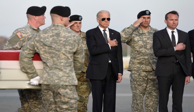 Then-Vice President Joe Biden, as an Army carry team moves a transfer case containing the remains of Pfc. Tyler R. Iubelt at Dover Air Force Base, Del., Tuesday, Nov. 15, 2016. According to the Department of Defense, Iubelt, 20, of Tamaroa, Ill., died Nov. 12 of injuries sustained from an improvised explosive device in Bagram, Afghanistan while supporting Operation Freedom's Sentinel. (AP Photo/Steve Ruark)
