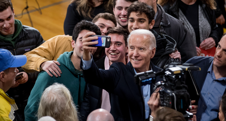 Democratic presidential candidate former Vice President Joe Biden takes a photograph with members of the audience as he speaks at a campaign stop at Roosevelt Creative Corridor Business Academy, Saturday, Feb. 1, 2020, in Cedar Rapids, Iowa. (AP Photo/Andrew Harnik)