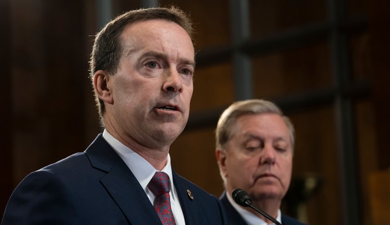In this May 15, 2019, file photo, acting U.S. Customs and Border Protection Commissioner John Sanders, left, joins Senate Judiciary Committee Chairman Lindsey Graham, R-S.C., right, on Capitol Hill in Washington.