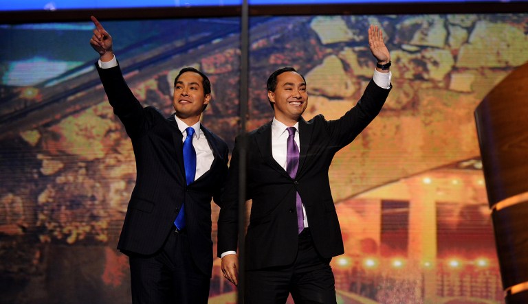 Julian Castro, mayor of San Antonio, left, waves while on stage with his brother Representative Joaquin Castro.