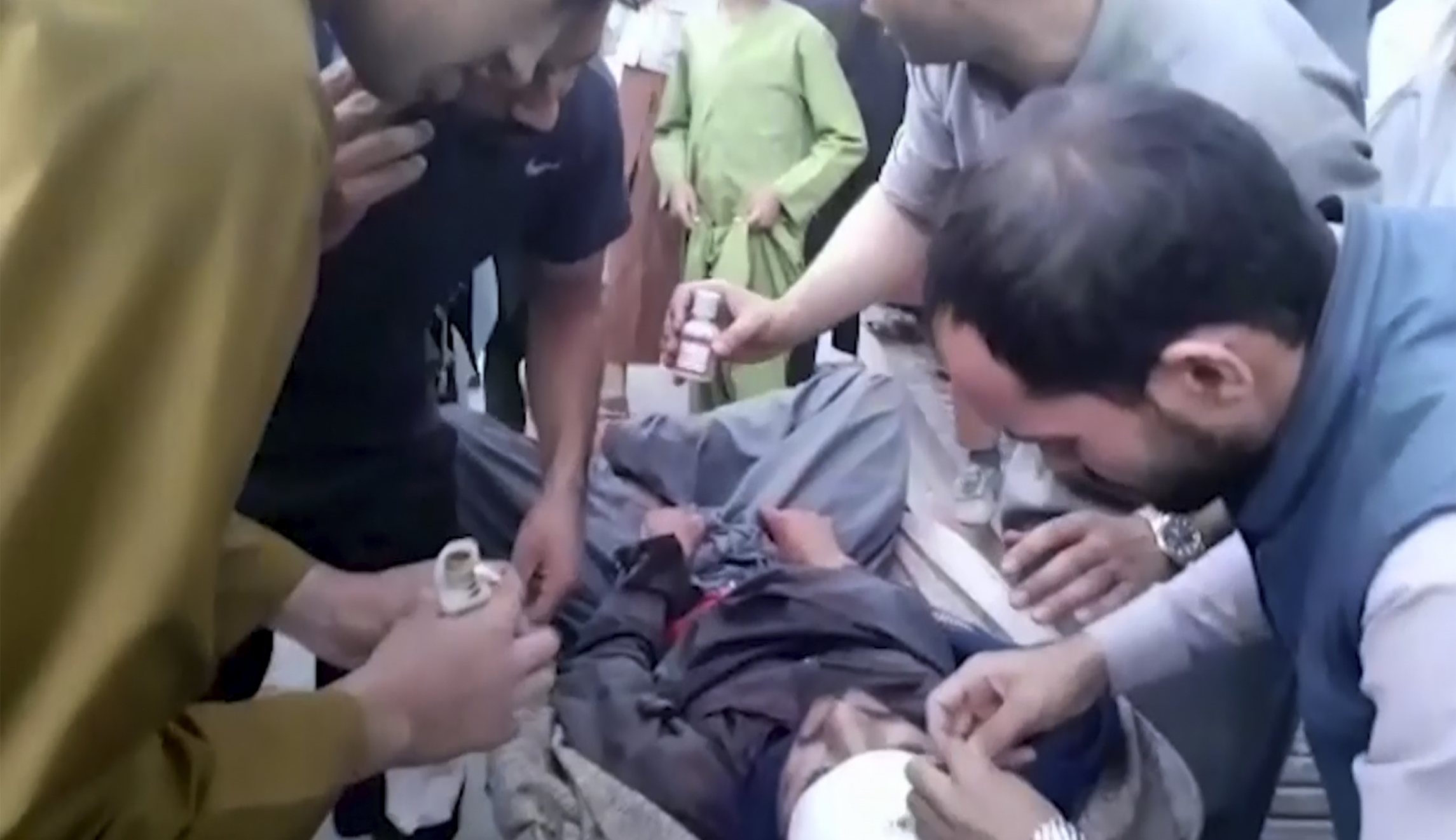 Dozens dead in Afghanistan after attack on maternity ward and suicide bombing at funeral