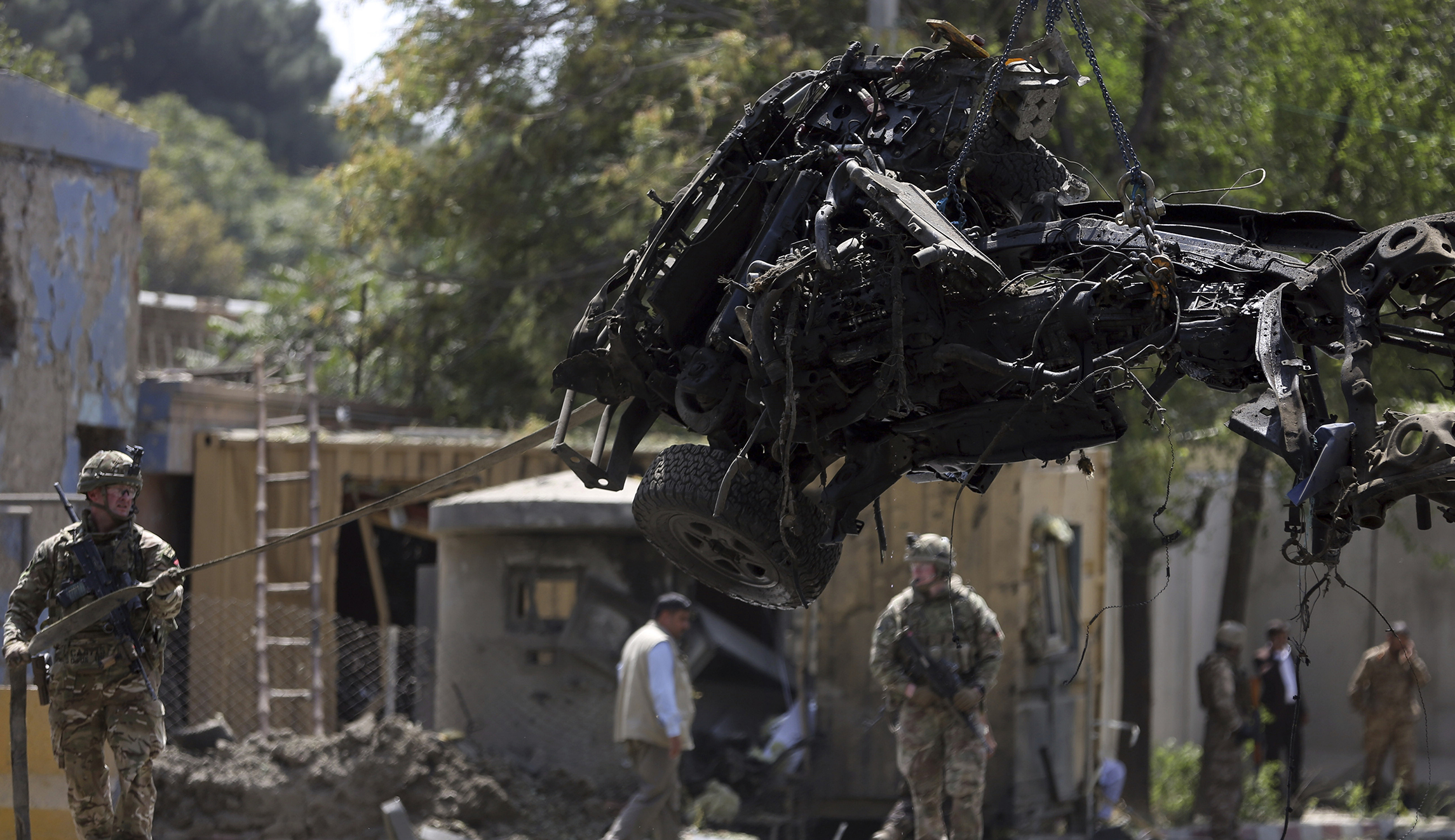 Afghan peace deal in doubt as American solider among dozen killed by Taliban bomb in Kabul