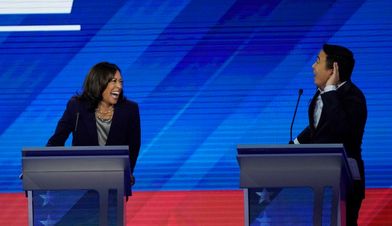 Sen. Kamala Harris, D-Calif., left, reacts to entrepreneur Andrew Yang during a Democratic presidential primary debate.