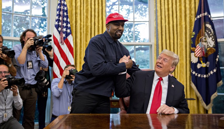 Rapper Kanye West, left, shakes hands with U.S. President Donald Trump during a meeting in the Oval Office on Thursday, Oct. 11, 2018. West, a recording artist and prominent Trump supporter, was at the White House to have lunch with the president and to meet with presidential son-in-law and senior adviser Jared Kushner, who has spearheaded the administration's efforts to overhaul the criminal justice system.