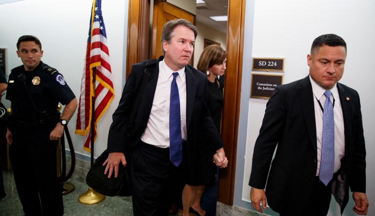 Supreme Court nominee Brett Kavanaugh and his wife Ashley Estes Kavanaugh, hold hands as they leave a holding room after a Senate Judiciary Committee hearing on Capitol Hill in Washington, Thursday, Sept. 27, 2018.
