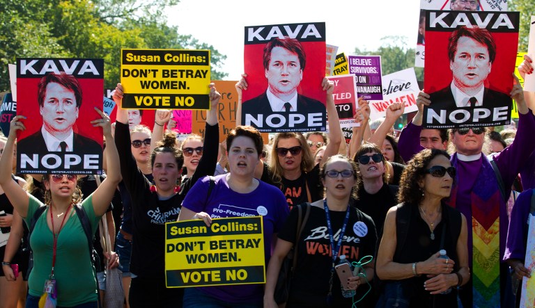 Demonstrators protest against Supreme Court nominee Brett Kavanaugh, as they march to the U.S. Supreme Court, on Thursday, Oct. 4, 2018, in Washington.