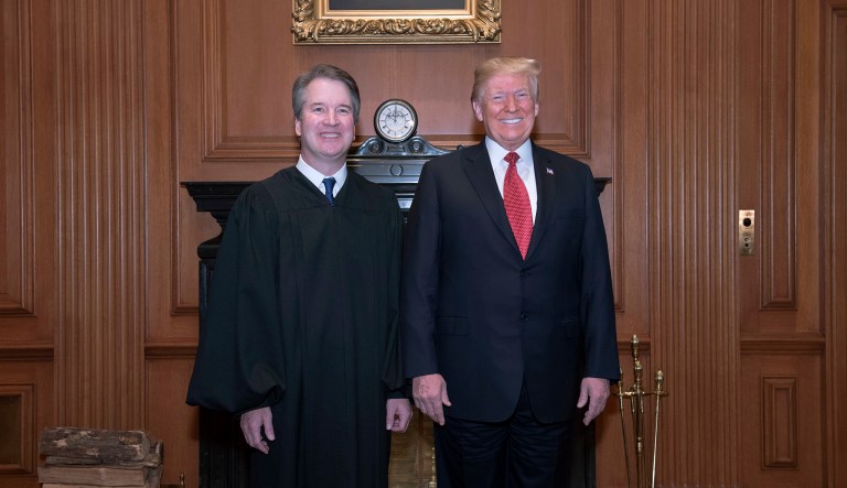 In this image provided by the Supreme Court, President Donald Trump poses for a photo with Associate Justice Brett Kavanaugh in the Justices' Conference Room before a investiture ceremony Thursday, Nov. 8, 2018, at the Supreme Court in Washington.