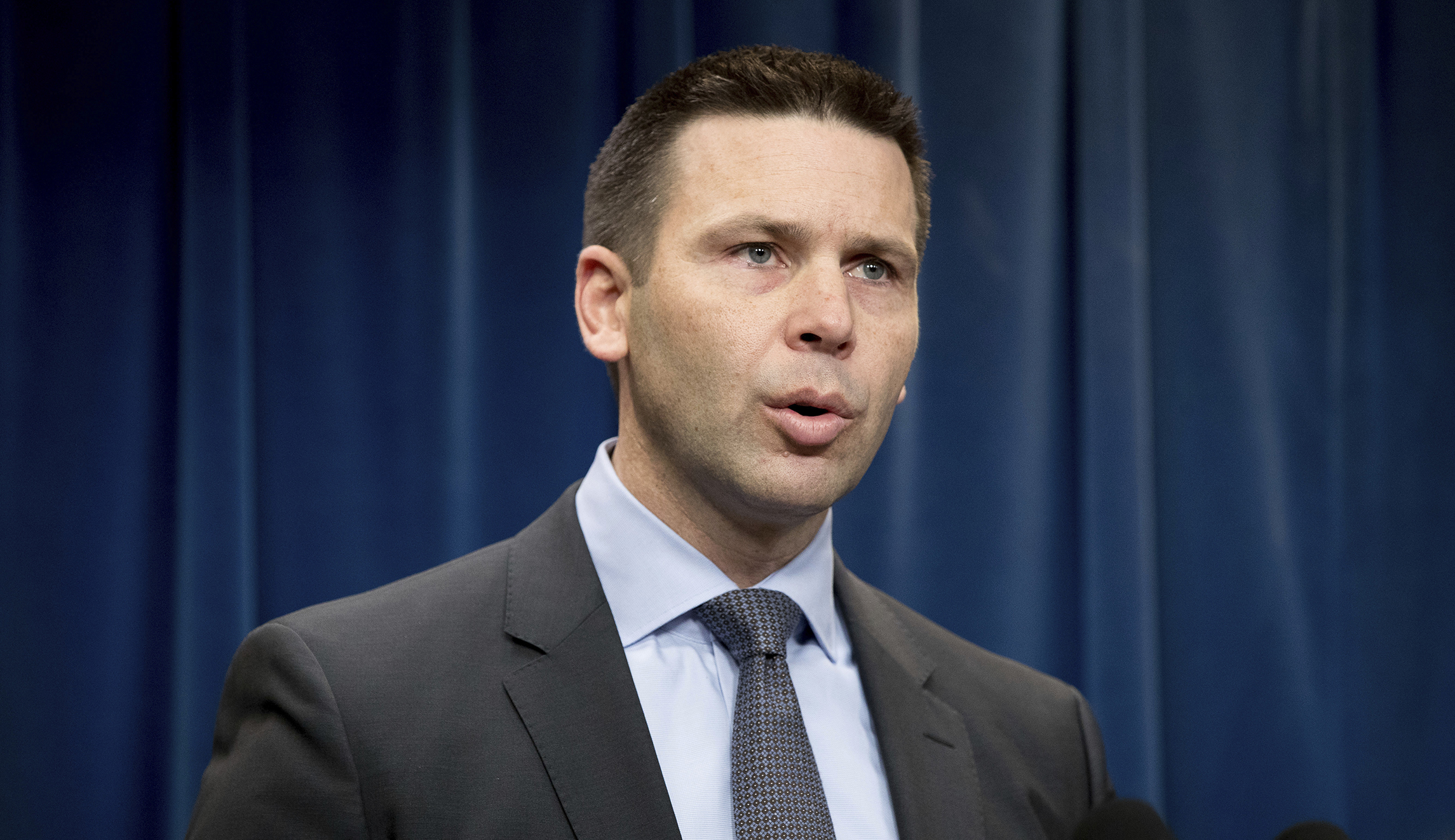 Rock thrower who nearly hit top US border official remains at large