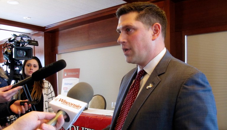 Wisconsin Republican Senate candidate Kevin Nicholson speaks with reporters Tuesday, Jan. 30, 2018, in Madison, Wis. Nicholson says he thinks his past as a Democrat will help him in the election because many Wisconsin voters have gone through a similar transformation.