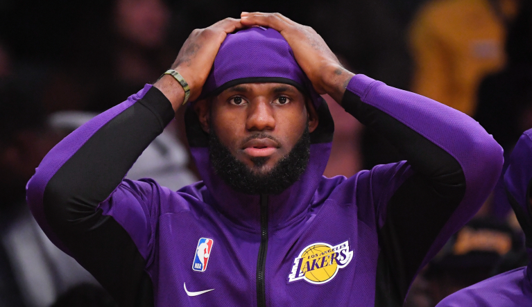 Los Angeles Lakers forward LeBron James sits on the bench during the first half of a preseason NBA basketball game against the Golden State Warriors, Monday, Oct. 14, 2019, in Los Angeles. 