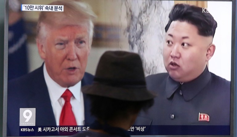 In this Thursday, Aug. 10, 2017, file photo, a man watches a television screen showing U.S. President Donald Trump, left, and North Korean leader Kim Jong Un during a news program at the Seoul Train Station in Seoul, South Korea. North Korea has announced a detailed plan to launch a salvo of ballistic missiles toward the U.S. Pacific territory of Guam, a major military hub and home to U.S. bombers. If carried out, it would be the North's most provocative missile launch to date.