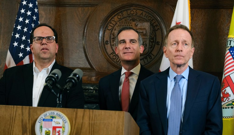 From left, Union President Alex Caputo-Pearl, Austin Beutner, Superintendent of the Los Angeles Unified School District, and Los Angeles Mayor Eric Garcetti listen to questions during a news conference after a tentative deal was reached Tuesday, Jan. 22, 2019, between school officials and the teachers union that will allow educators to return to classrooms after a six-day strike against the nation's second-largest district.