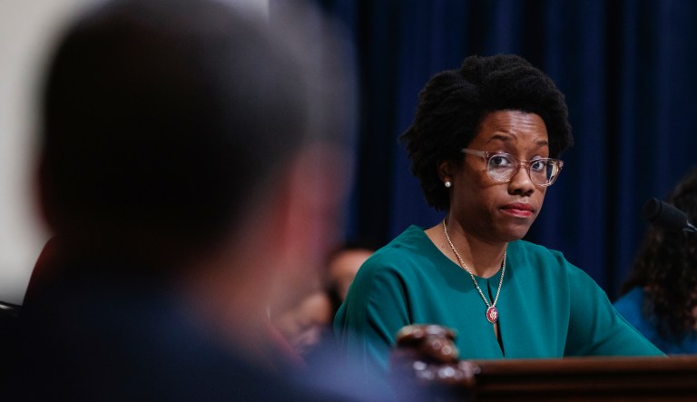 In this Aug. 25, 2018, photo, rookie Democratic candidate Lauren Underwood poses for a photo in Chicago. If elected to the U.S. House, Underwood would be the first woman and first minority to represent the predominantly white district once represented by GOP House Speaker Dennis Hastert.