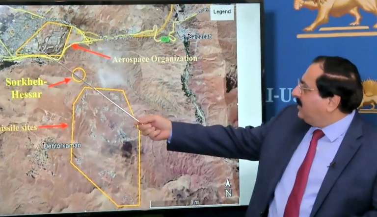 Alireza Jafarzadeh, deputy director of the National Council of Resistance of Iran's Washington office, displays satellite imagery purporting to show the location of a previously undisclosed Iranian military site during a news conference in Washington, D.C., on Friday.