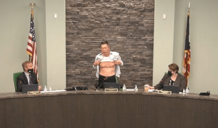 Asian American veteran and town trustee bears chest scars to make a point about discrimination