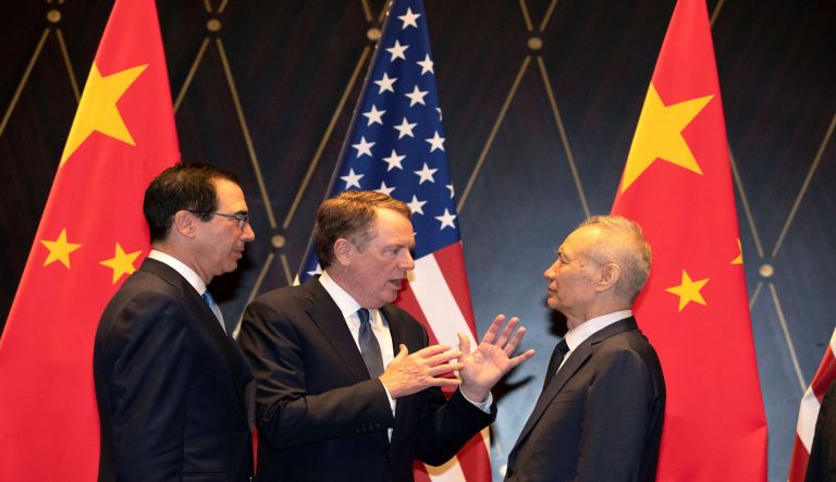 In this on Wednesday, July 31, 2019 file photo, U.S. Trade Representative Robert Lighthizer, center, gestures as he chats with Chinese Vice Premier Liu He, right, with Treasury Secretary Steven Mnuchin, left, looking on after posing for a photo at the Xijiao Conference Center in Shanghai. U.S. and Chinese negotiators are scheduled to begin a 13th round of talks Thursday, Oct. 10, aimed at ending a 15-month trade war that is worrying global investors and weighing on the world economy. Chinese Vice Premier Liu He will lead a delegation into meetings in Washington with U.S. Trade Representative Lighthizer and Treasury Secretary Mnuchin