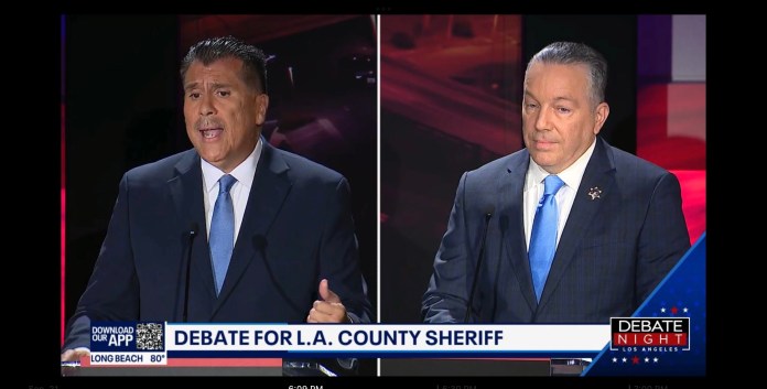 Los Angeles County sheriff candidates Robert Luna, left, and incumbent Alex Villanueva, right, hold a televised debate on Sept. 21, 2022.