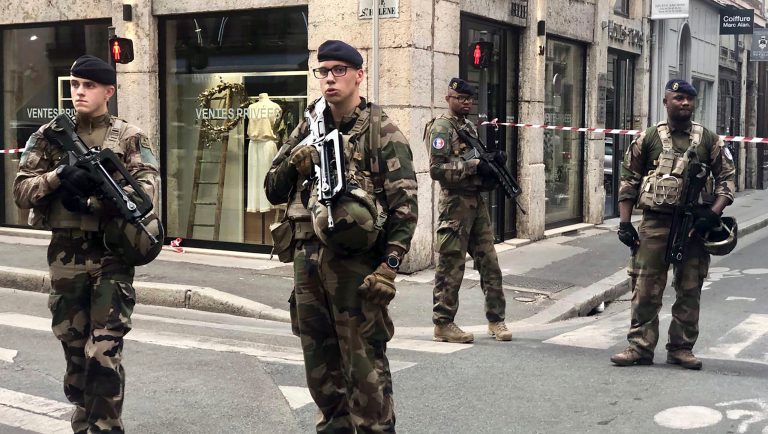 Soldiers of French antiterrorist plan "Vigipirate Mission", secure the access near the site of a suspected bomb attack in central Lyon, Friday May, 24, 2019. A small explosion Friday on a busy street in the French city of Lyon lightly injured several people, local officials said.