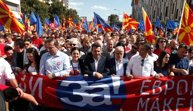 Macedonian Prime Minister Zoran Zaev, center, takes a part in a march named "For European Macedonia", through a street in Skopje, Macedonia, Sunday, Sept. 16, 2018.
