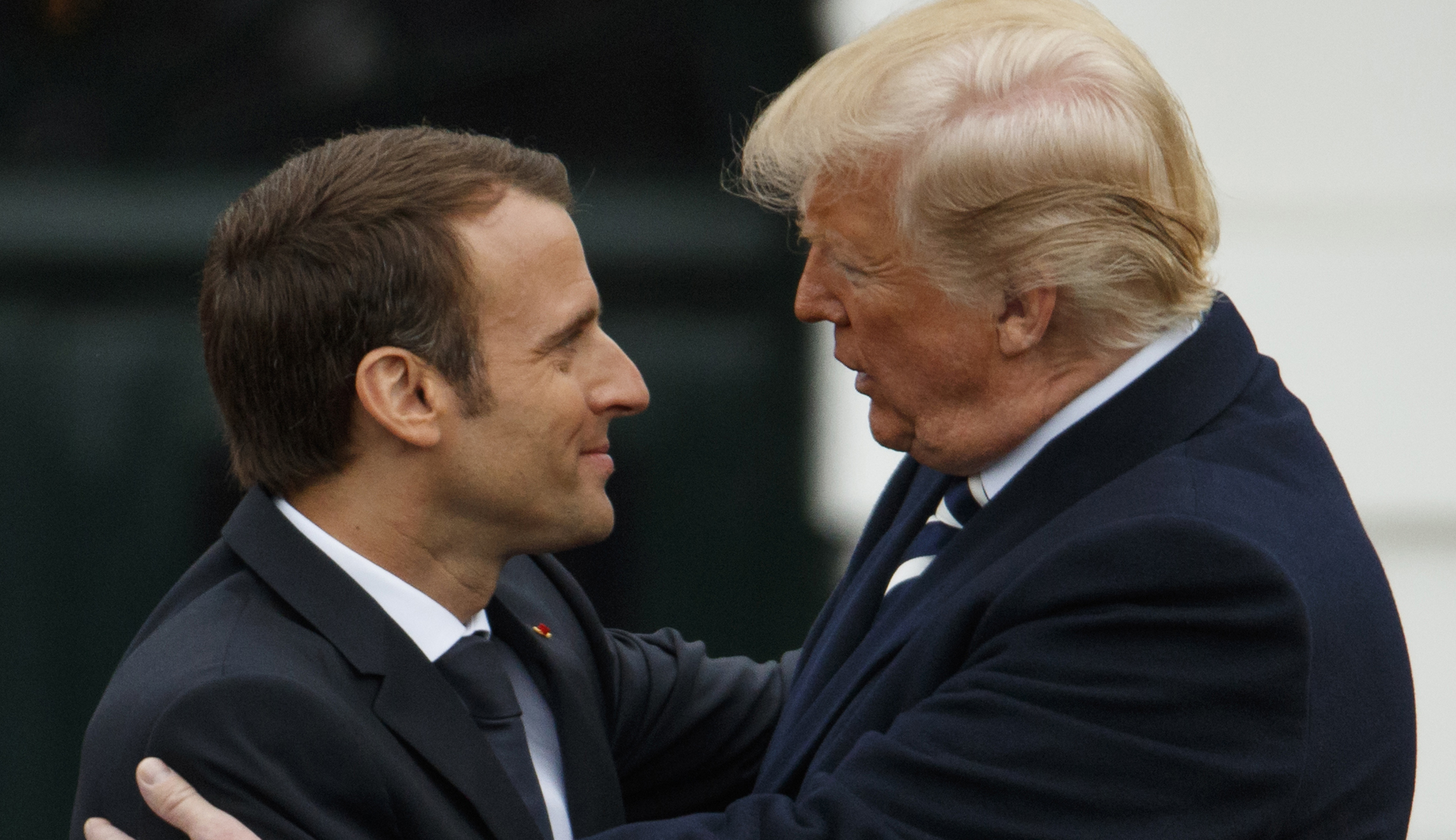 Trump, Macron bond with kiss, affectionate handshake: WATCH