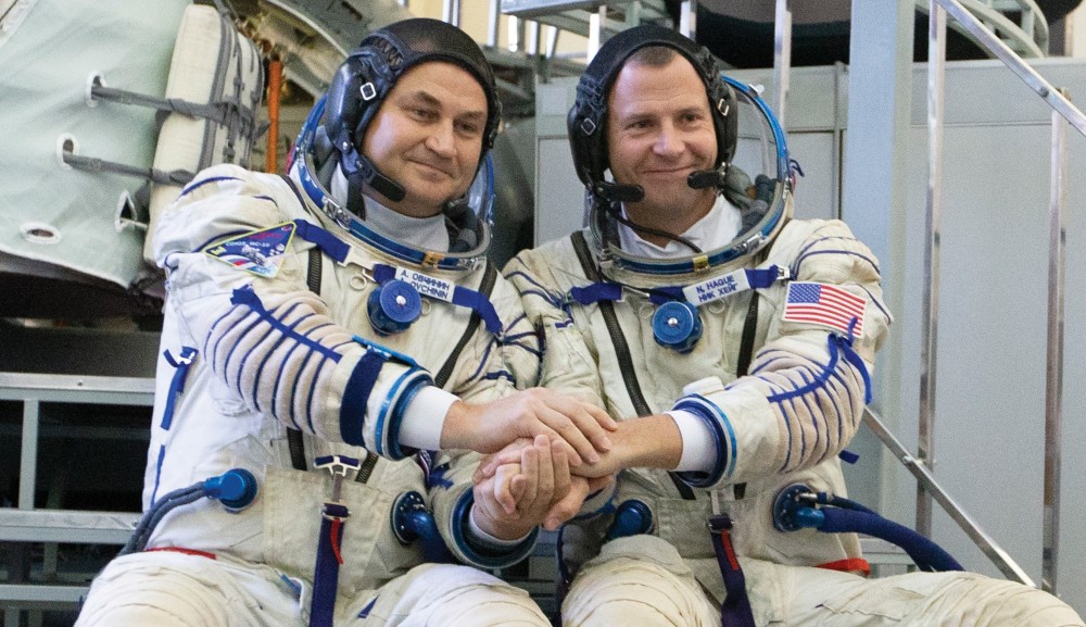 U.S. astronaut Nick Hague, right, and Russian cosmonaut Alexey Ovchinin pose for a photo before their final preflight practical examination in a mock-up of a Soyuz spacecraft at the Gagarin Cosmonaut Training Center in Star City, Russia, on Sept. 14. They are scheduled to launch on Oct. 11 from the Baikonur Cosmodrome in Kazakhstan on the Soyuz MS-10 spacecraft for a six-month mission on the International Space Station.