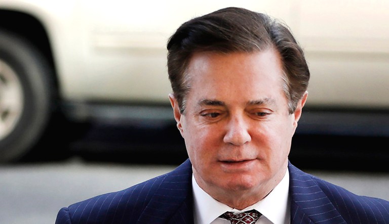 Paul Manafort, former campaign manager for President Trump, left, arrives at federal court in Washington, D.C.