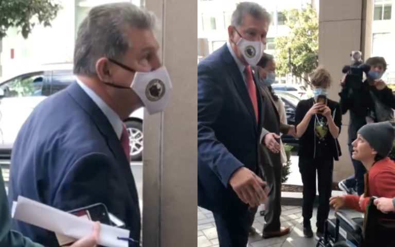 Manchin being approached by a protester.