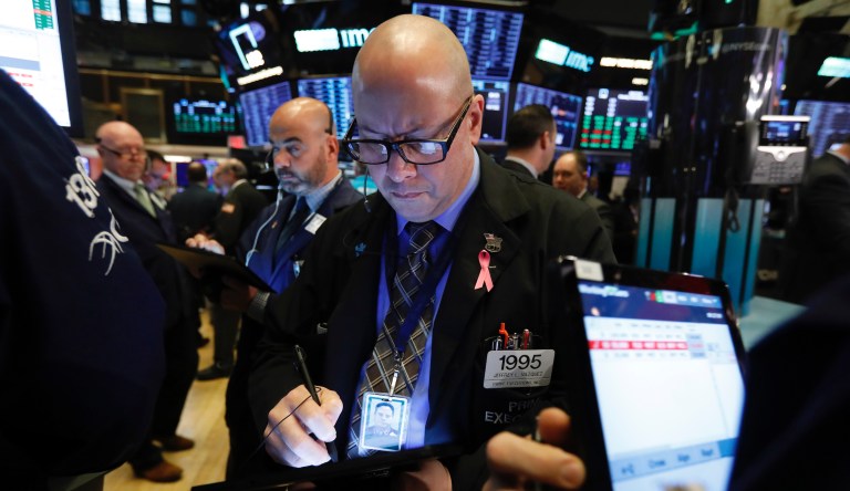 Trader Jeffrey Vazquez, center, works on the floor of the New York Stock Exchange, Monday, Nov. 4, 2019. Stocks are opening higher on Wall Street, pushing major indexes toward more record highs. 