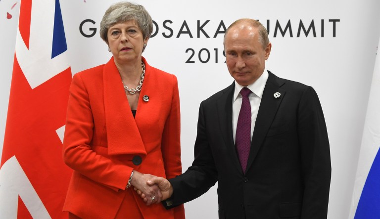 Russian President Vladimir Putin and British Prime Minister Theresa May meet on the sidelines of the G-20 summit in Osaka, western Japan, Friday, June 28, 2019.