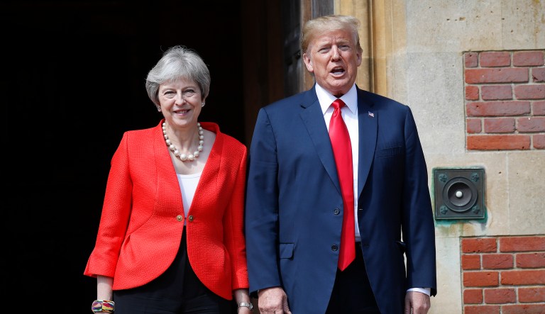 U.S. President Donald Trump, right, stands with British Prime Minister Theresa May, left, at Chequers, in Buckinghamshire, England, Friday, July 13, 2018.